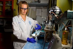 EPA engineering technician Christy Muhlen at the Andrew W. Breidenbach Environmental Research Center Lab in Cincinnati synthesizes lead particles to investigate lead corrosion. 